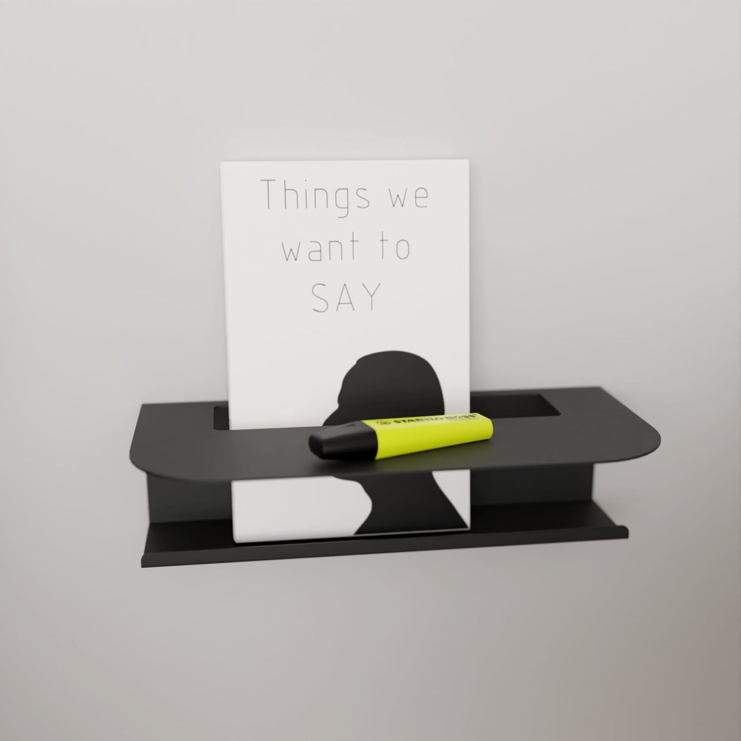 Modern black metal wall shelf holding a glass of water and a book, perfect for minimalist home decor by DnzHomeDesign.
