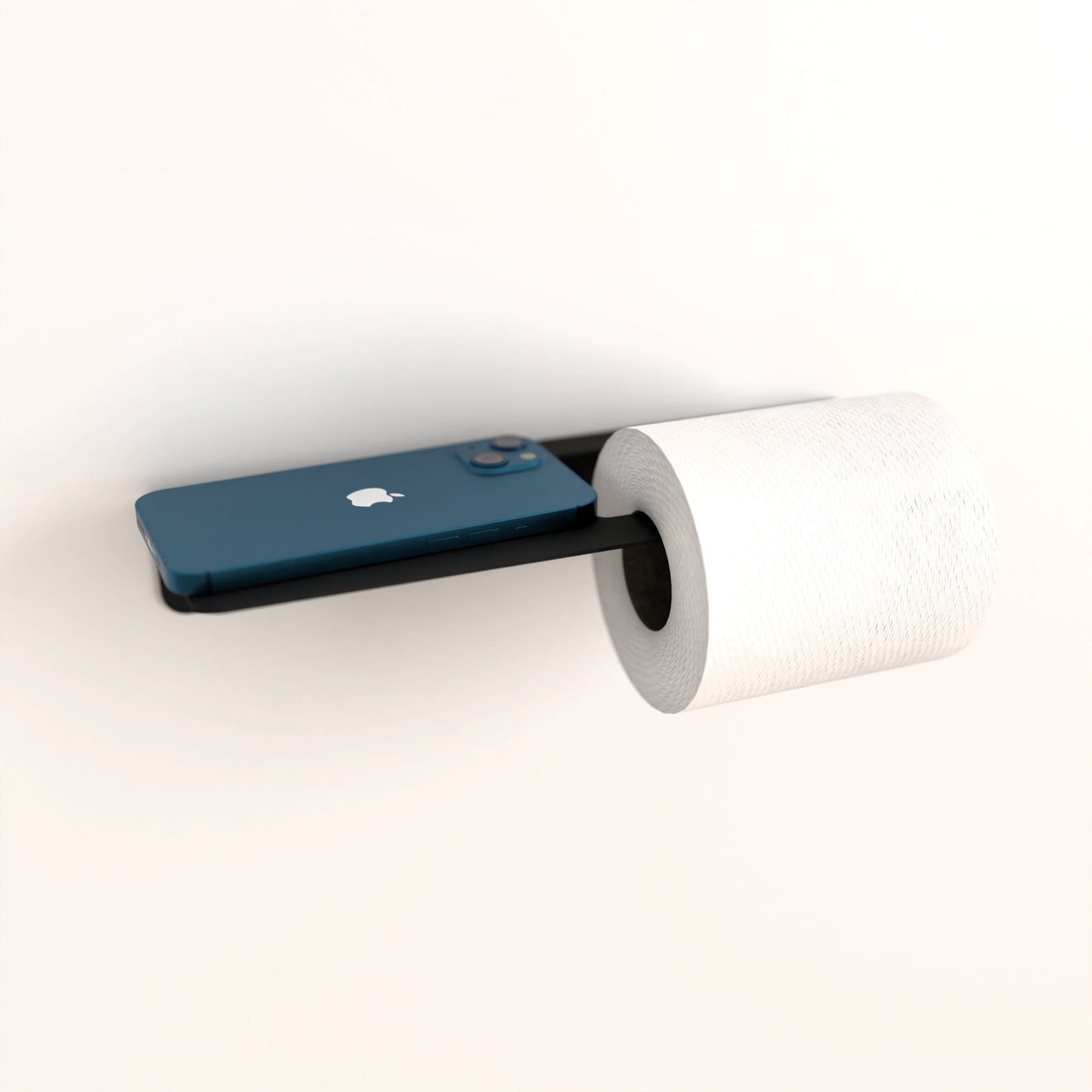 Black metal toilet paper holder, blue smartphone, bathroom shelf, sleek design.